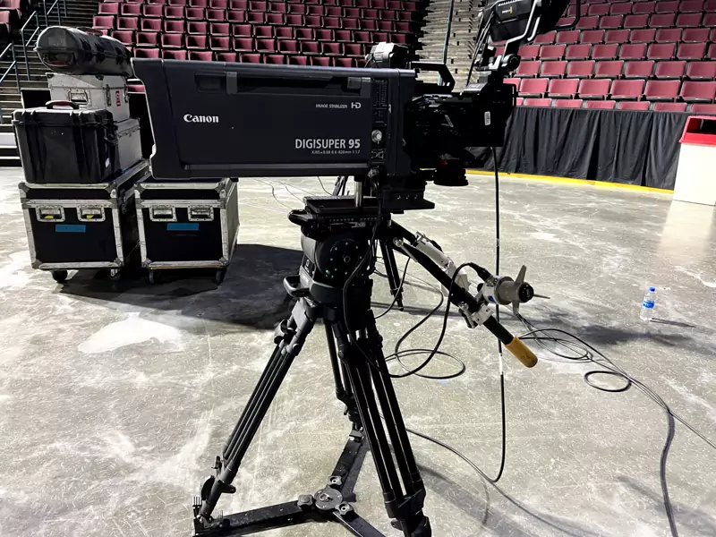 Camera operator filming a corporate general session for the screens