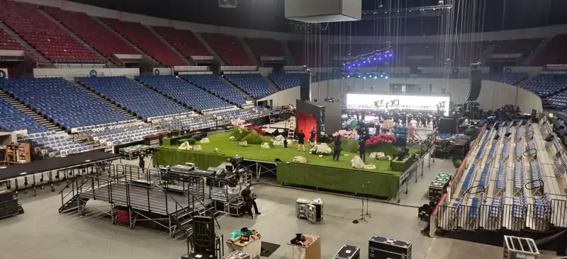 Arena floor with a stage and set being built