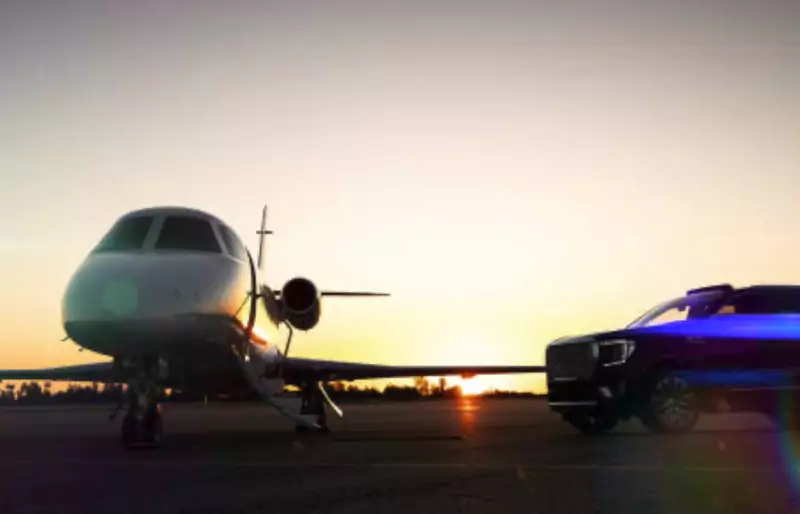 Private jet and an SUV on the runway at sunset